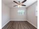 Bright bedroom with hardwood floors, fresh paint and two windows offering plenty of natural light at 4226 Kelly Miller Ct, Orlando, FL 32811