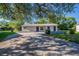 Single-story home with a stone accent wall and well-manicured front yard at 4226 Kelly Miller Ct, Orlando, FL 32811