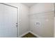 Laundry room with washer and dryer hookups, a storage shelf, and a door at 4226 Kelly Miller Ct, Orlando, FL 32811