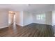 Bright living room with wood-look floors, recessed lighting, and large windows at 4226 Kelly Miller Ct, Orlando, FL 32811
