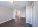 Open living room space featuring wood-look flooring and neutral paint throughout at 4226 Kelly Miller Ct, Orlando, FL 32811