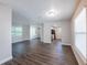 Spacious living room featuring wood-look floors, neutral paint, and ample natural light at 4226 Kelly Miller Ct, Orlando, FL 32811