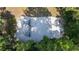 Aerial view of a playground with play structures on a sandy area surrounded by trees at 424 Club Dr, Winter Springs, FL 32708