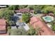 Aerial view of community featuring lush trees, townhomes, pool, and parking at 424 Club Dr, Winter Springs, FL 32708