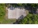 Aerial view of a beach volleyball court surrounded by trees at 424 Club Dr, Winter Springs, FL 32708