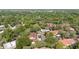 Expansive aerial view of a community nestled in lush greenery with a communal pool at 424 Club Dr, Winter Springs, FL 32708