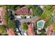 Aerial view of community featuring lush trees, townhomes, pool, and parking at 424 Club Dr, Winter Springs, FL 32708