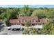 Aerial view of townhomes and parking areas surrounded by lush trees at 424 Club Dr, Winter Springs, FL 32708