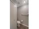 Neutral bathroom with toilet, linen closet, and towel rack at 424 Club Dr, Winter Springs, FL 32708