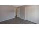 This is a bedroom with laminate floors, a closet, and a door leading to another room at 424 Club Dr, Winter Springs, FL 32708