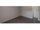 This bedroom features laminate floors and a door leading to another room at 424 Club Dr, Winter Springs, FL 32708