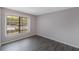 Bedroom with laminate floors and a window with a view of a parking lot at 424 Club Dr, Winter Springs, FL 32708