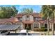 Exterior shot of townhouse with red tile roof and covered parking at 424 Club Dr, Winter Springs, FL 32708