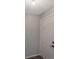 View of a brightly lit foyer with a clean white door and modern light fixture at 424 Club Dr, Winter Springs, FL 32708