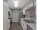 Bright kitchen with stainless steel appliances, white subway tile, and white cabinetry at 424 Club Dr, Winter Springs, FL 32708