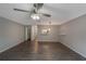 Open concept living room featuring modern ceiling fan, grey walls, and hardwood floors at 424 Club Dr, Winter Springs, FL 32708