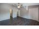 Spacious main bedroom with laminate floors, a ceiling fan and dual closets at 424 Club Dr, Winter Springs, FL 32708