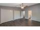 Spacious main bedroom with laminate floors, a ceiling fan and dual closets at 424 Club Dr, Winter Springs, FL 32708