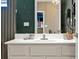 Bathroom with quartz countertop and views to a bedroom and stylish accent walls and decor at 4441 Ganesha Loop, Kissimmee, FL 34746