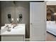 Modern bathroom with a quartz countertop, modern sink and faucet, with an adjoining bedroom at 4441 Ganesha Loop, Kissimmee, FL 34746