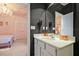 Stylish bathroom vanity with modern fixtures, adjacent to a princess-themed bedroom with unique decorations at 4441 Ganesha Loop, Kissimmee, FL 34746