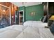 Themed bedroom featuring two twin beds, green walls and custom wall art with themed decor at 4441 Ganesha Loop, Kissimmee, FL 34746