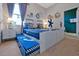 Nautical-themed bedroom featuring bunk beds with a pullout trundle, a ship wheel, and ocean-inspired decor at 4441 Ganesha Loop, Kissimmee, FL 34746