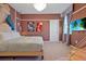 Stylish bedroom with modern decor, a unique hanging swing chair, and plush carpeting at 4441 Ganesha Loop, Kissimmee, FL 34746
