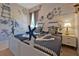 Nautical themed bedroom with twin beds and decorative ship accents on a textured brick wall at 4441 Ganesha Loop, Kissimmee, FL 34746