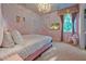 Beautiful bedroom with a pink bed frame, castle-themed wall art, and a whimsical rocking unicorn at 4441 Ganesha Loop, Kissimmee, FL 34746
