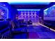 Home theater room with tiered seating, plush leather chairs and a large projection screen at 4441 Ganesha Loop, Kissimmee, FL 34746