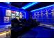 Home theater with plush leather chairs, cup holders, decorative lighting and movie posters at 4441 Ganesha Loop, Kissimmee, FL 34746