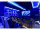 Home theater room with tiered seating, plush leather chairs, and a large projection screen at 4441 Ganesha Loop, Kissimmee, FL 34746