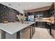 Spacious kitchen with stainless steel appliances, a large island, and modern finishes at 4441 Ganesha Loop, Kissimmee, FL 34746