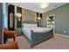 Stylish main bedroom showcasing a luxurious bed, elegant lighting fixtures, and decorative accents with lots of space at 4441 Ganesha Loop, Kissimmee, FL 34746