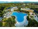 Aerial view of community amenities, including a pool, mini golf, and clubhouse at 454 Captiva Dr, Davenport, FL 33896