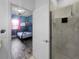 Contemporary bathroom with glass enclosed shower and tiled walls at 454 Captiva Dr, Davenport, FL 33896