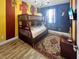 bedroom with bunkbeds, rug, dark brick wall and cute decoration at 454 Captiva Dr, Davenport, FL 33896