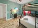 Fun themed bedroom with bunkbeds, wood floors and cute decoration at 454 Captiva Dr, Davenport, FL 33896