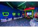 Colorful game room with custom lighting, seating and mounted screens at 454 Captiva Dr, Davenport, FL 33896