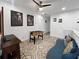 Bright game room with foosball table, TV, ceiling fan and hardwood floors at 454 Captiva Dr, Davenport, FL 33896