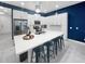 Bright kitchen with white cabinets, stainless steel appliances, and quartz countertops at 454 Captiva Dr, Davenport, FL 33896