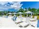 Relaxing lounge chairs and canopies surround a community pool, offering a tranquil oasis for residents under a sunny sky at 454 Captiva Dr, Davenport, FL 33896