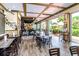 A restaurant space includes wood flooring and an outside patio with seating, with a large bar for socializing at 454 Captiva Dr, Davenport, FL 33896