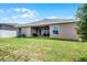 Backyard featuring a covered patio and well maintained lawn at 503 Meadow Pointe Dr, Haines City, FL 33844