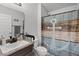Bathroom featuring a single sink vanity with decorative mirror, toilet, and shower at 503 Meadow Pointe Dr, Haines City, FL 33844