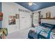 Bedroom featuring custom wall decor, ceiling fan and natural light from the window at 503 Meadow Pointe Dr, Haines City, FL 33844