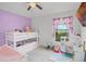 Bedroom featuring a bunk bed, ceiling fan and natural light from the window at 503 Meadow Pointe Dr, Haines City, FL 33844
