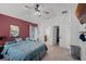 Bedroom showcasing a ceiling fan, walk-in closet, and attached bathroom at 503 Meadow Pointe Dr, Haines City, FL 33844