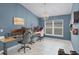 Bright bedroom with large window, neutral paint, and stylish chandelier lighting at 503 Meadow Pointe Dr, Haines City, FL 33844